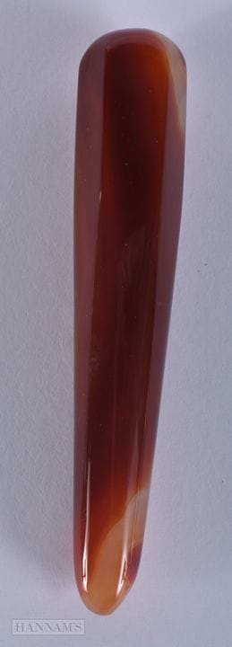 AN AGATE PESTLE. 12 cm long.