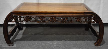 A 19TH CENTURY CHINESE CARVED HUANGHUALI WOOD LOW 