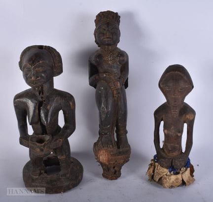 THREE AFRICAN TRIBAL WOOD FIGURES. 36 cm high. (3)