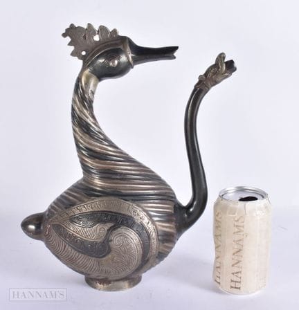AN INDIAN MULTI TONE BRONZE BIRD HEAD EWER. 32 cm 