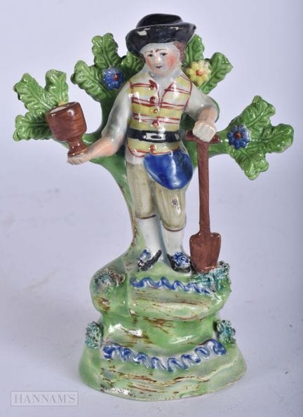 AN EARLY 19TH CENTURY STAFFORDSHIRE WALTON FIGURE 