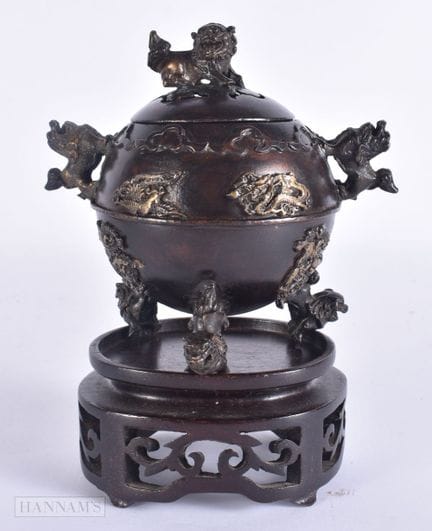 A CHINESE TWIN HANDLED BRONZE KORO AND COVER overl