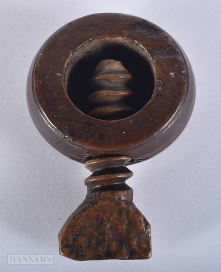 AN EARLY TREEN CARVED WOOD THUMB SCREW NUT CRACKER