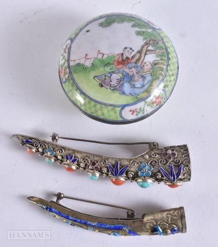 TWO CHINESE WHITE METAL FINGER GUARDS together wit