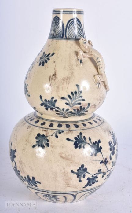 A 19TH CENTURY VIETNAMESE BLUE AND WHITE GOURD VAS
