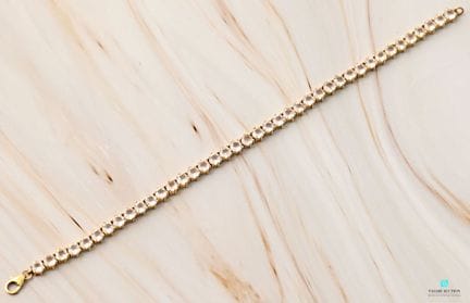 Bracelet ligne en argent doré 925 millièmes orné d
