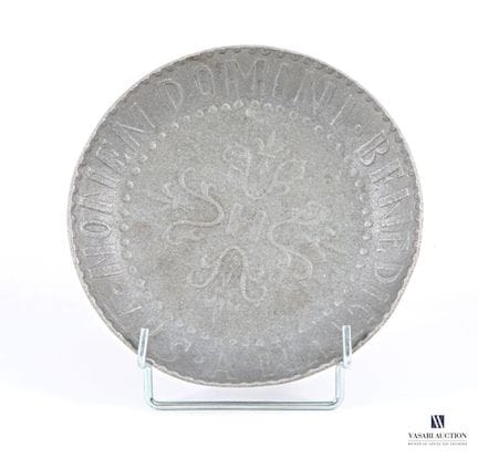 Pewter dish; the center of the basin features an "