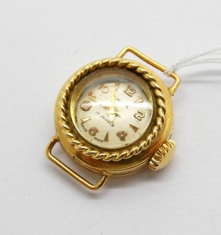 Petite montre en or jaune de marque EMKA vers 1960