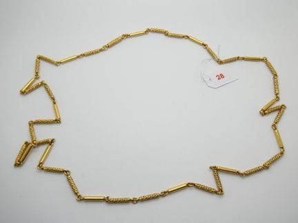 Collier en or jaune orné de motifs alternés de bag