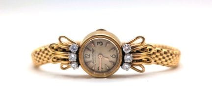 JAEGER LECOULTRE
18K黄金（750/1000）女士腕表，圆形表壳，镶嵌6颗钻石，棒