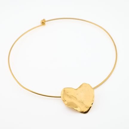 CECILE JEANNE. 
Collar tipo torque de metal dorado