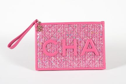 CHANEL. 
Pochette da mano in PVC e tweed rosa CHAN
