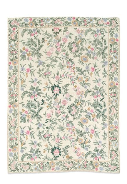 Wool rug embroidered on cotton, with an ivory-colo