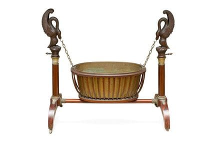Antique Empire-style cast-iron cauldron suspended 