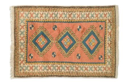Wool rug, 20th century
Featuring rhomboidal medall