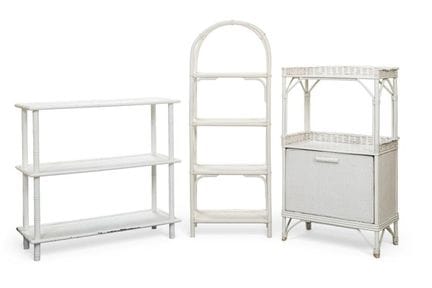 A set of white-painted bamboo shelving units consi