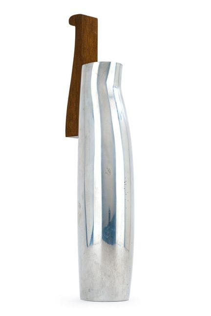 Modern tall vase in a chrome finish with wooden ha