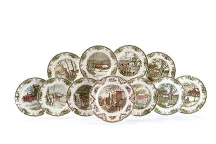 Set of 11 stamped earthenware plates, England, 20t