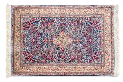 Persian wool rug with a floral design on a blue an