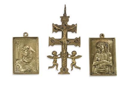 Set of three gilded bronze crucifixes: one depicti