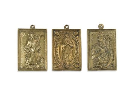 Set of three gilded bronze crucifixes. One feature