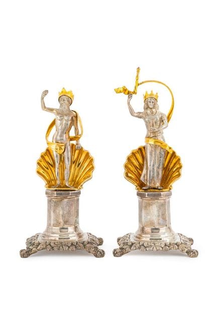 Pair of silver candlesticks depicting the mytholog