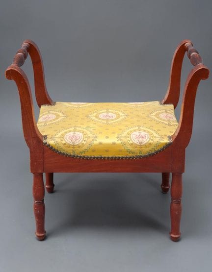 Bench made of weathered natural wood, resting on f