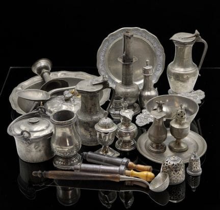 Set of pewter tableware pieces including carafes, 