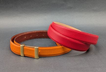 Reversible orange/brown leather belt, with a secon