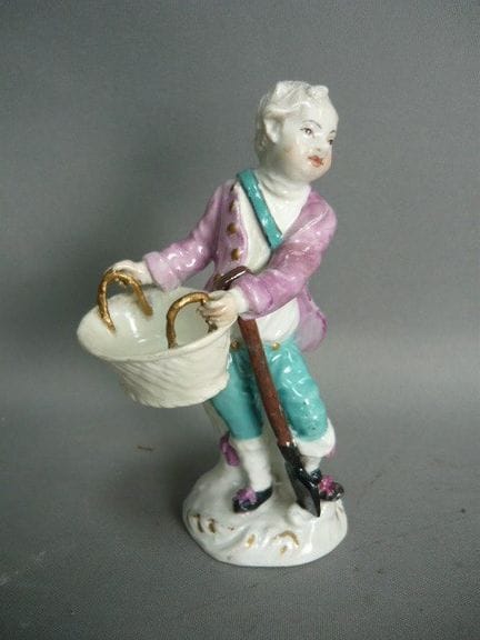 Boy with a basket. Meissen (Schwerter). Gardener's