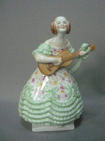 Herend, Hungary. A tall female guitarist in a beau