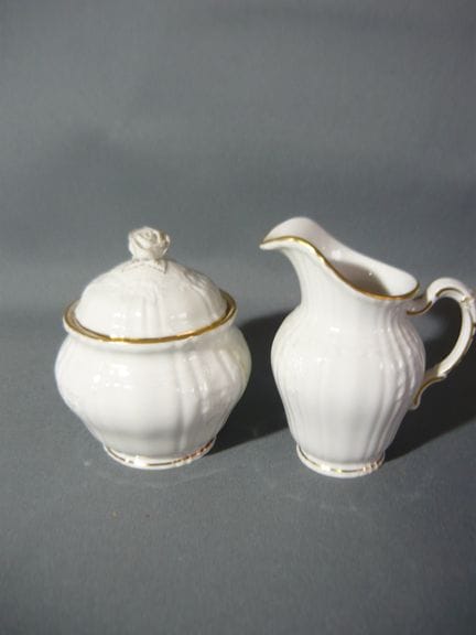 KPM Berlin. Rocaille with gold. Sugar bowl and mil