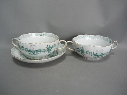 Soup bowls with saucers. Also includes a soup cup.