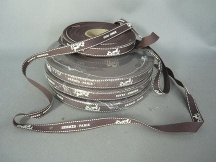 Set of 3.5 rolls of Hermès fabric ribbon, Paris. E