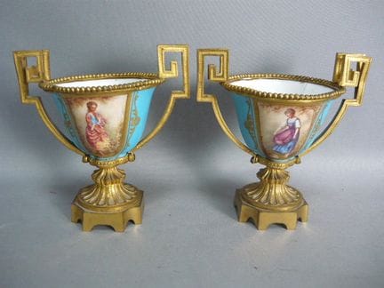 Pair of handled vases. Porcelain with rich decorat