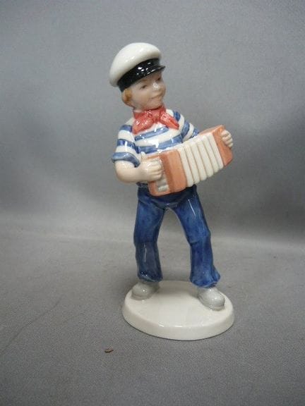 Boy with a harmonica. Royal Copenhagen, Denmark. H