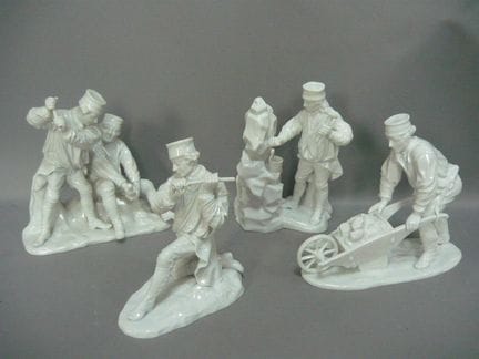 Four miner figurines (theme: miners, mining, etc.)
