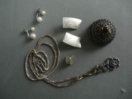 Assortment of silver jewelry and a lidded box—all 