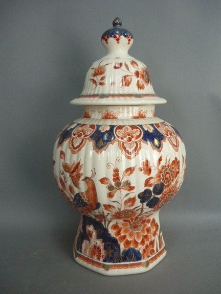 Magnificent lidded vase with hand-painted design. 