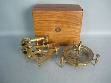 Two nautical measuring instruments. One in a box. 