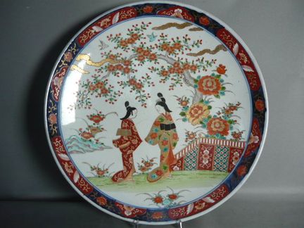 Huge plate with hand-painted Asian designs. Antiqu