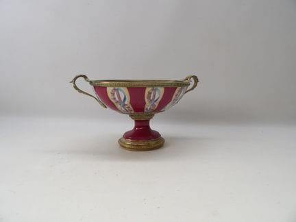 Oval bowl on a pedestal made of red-glazed polychr