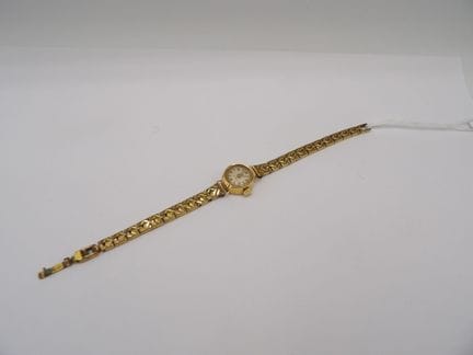 Montre boitier LIP en or jaune 18K, bracelet en mé