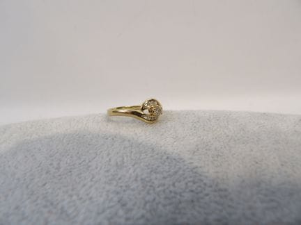 Bague tourbillon en or jaune, brillant et éclat de