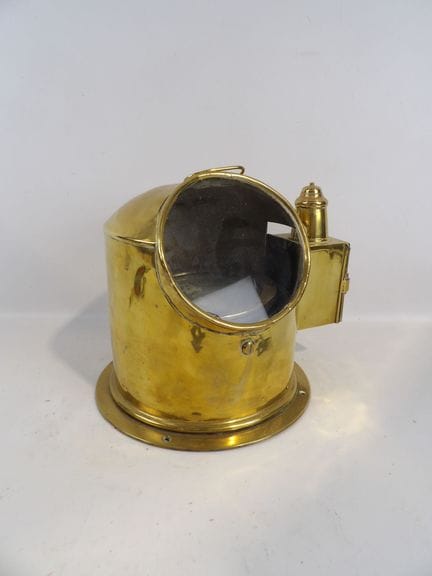 Brass marine compass with a side light. Height: 29