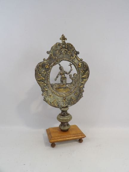 A copper repoussé monstrance element depicting a s