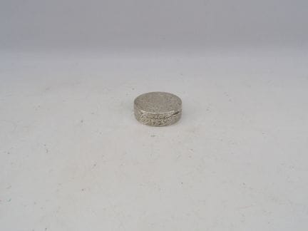 Low-purity silver powder compact with floral and g