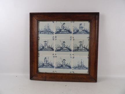 Set of 9 blue polychrome earthenware tiles on a wh
