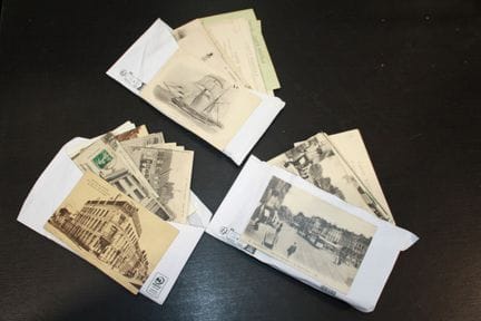Set of 3 envelopes of postcards, approximately 130