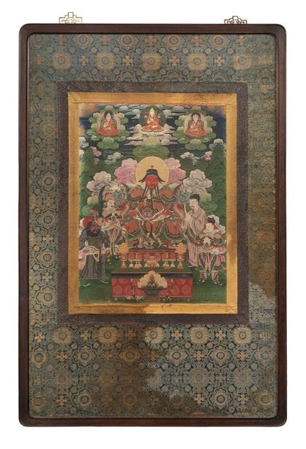 Thangka asiatica  

Rotolo con al centro la figura